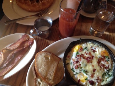 Lower east side breakfast: gruyere, egg and spinach skillet, perfect bloody mary, and bacon. 